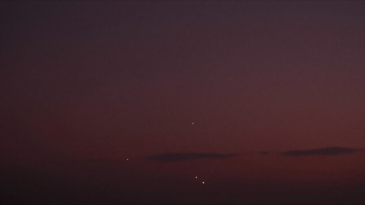 Scene of air particles glowing faintly like a sunset yet having no distinct form