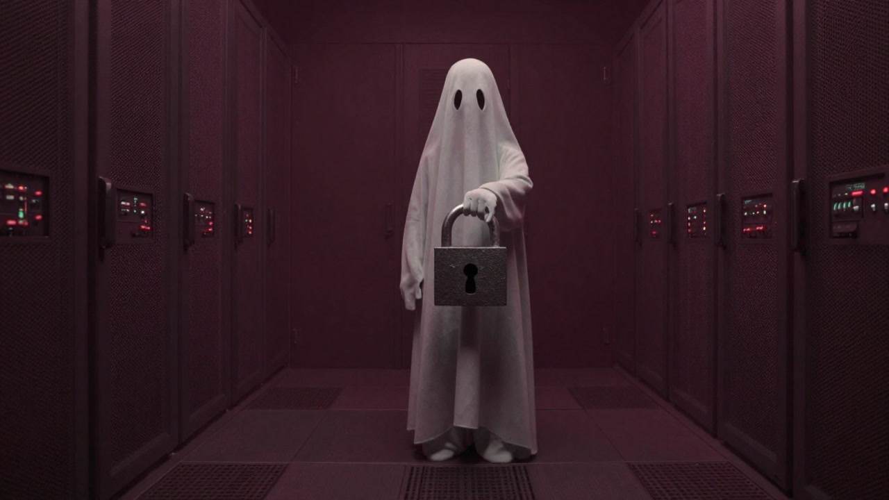 A ghostly digital figure holding a padlock symbol in a dark server room