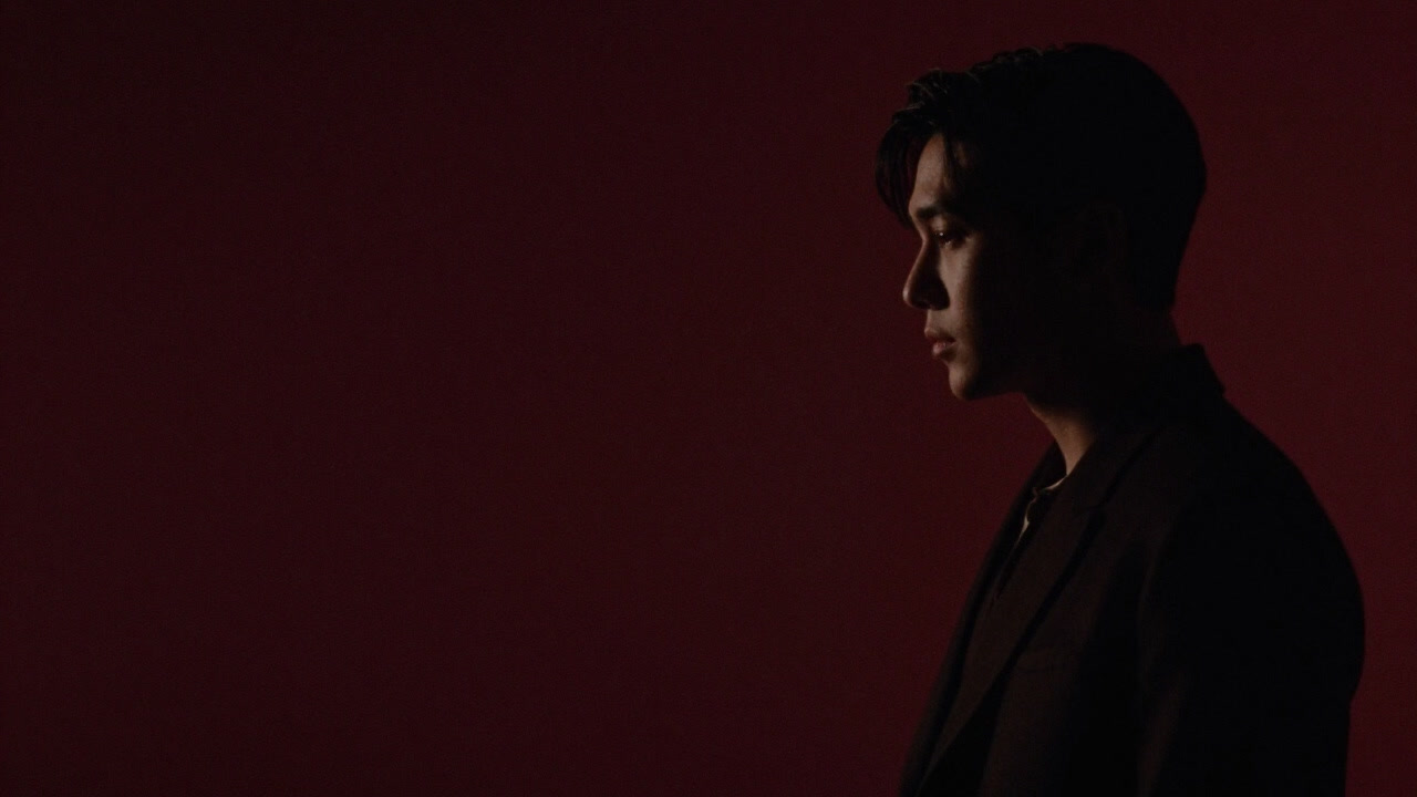 Image of a fleeting silhouette of an unassuming figure popping up in a film scene