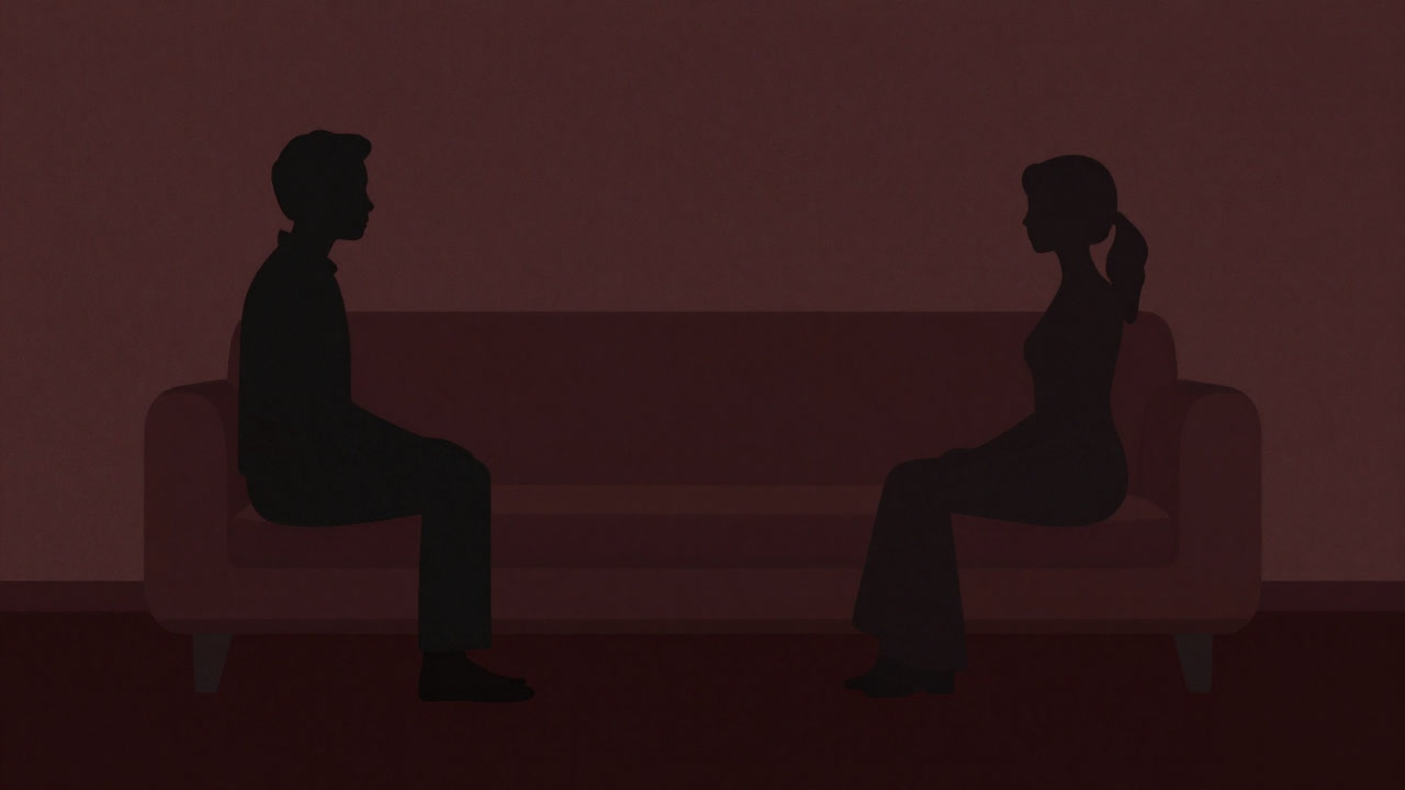 Silhouette of a counselor listening to a client on a couch in a calm room.