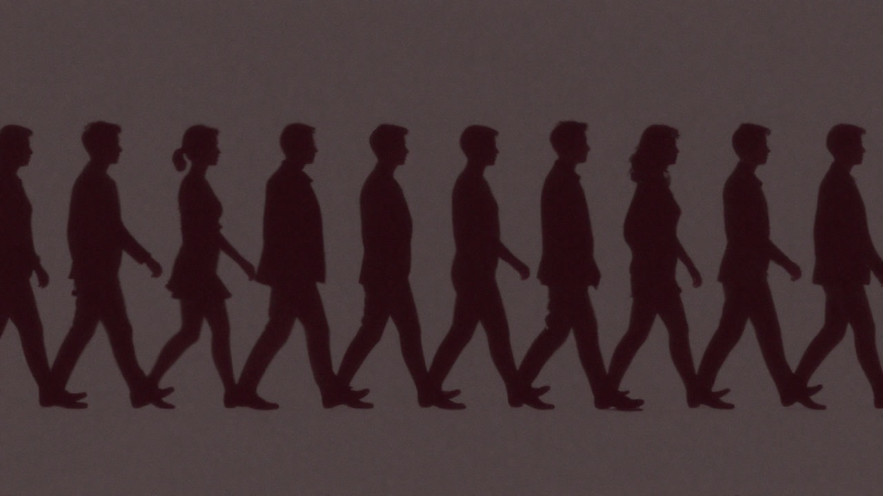 Silhouettes of people marching in perfect formation like shadows