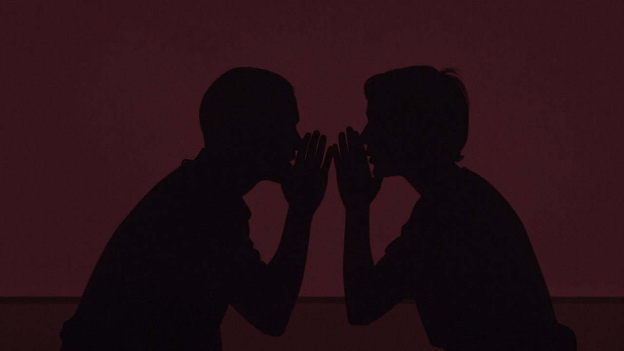 Silhouettes whispering rumors in the dark night