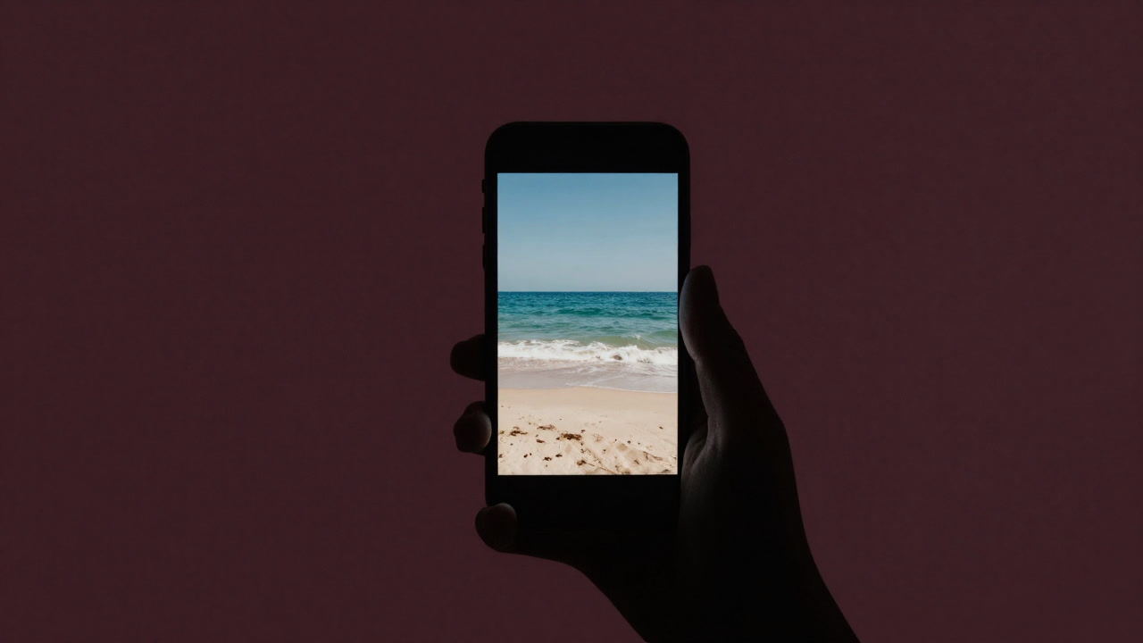 Silhouette of a person staring at an ideal beach photo on their smartphone screen