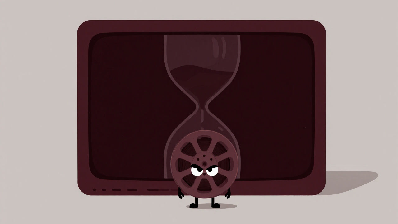 Image of a tiny film reel waiting before a dark screen resembling an hourglass, symbolizing fleeting cinema.