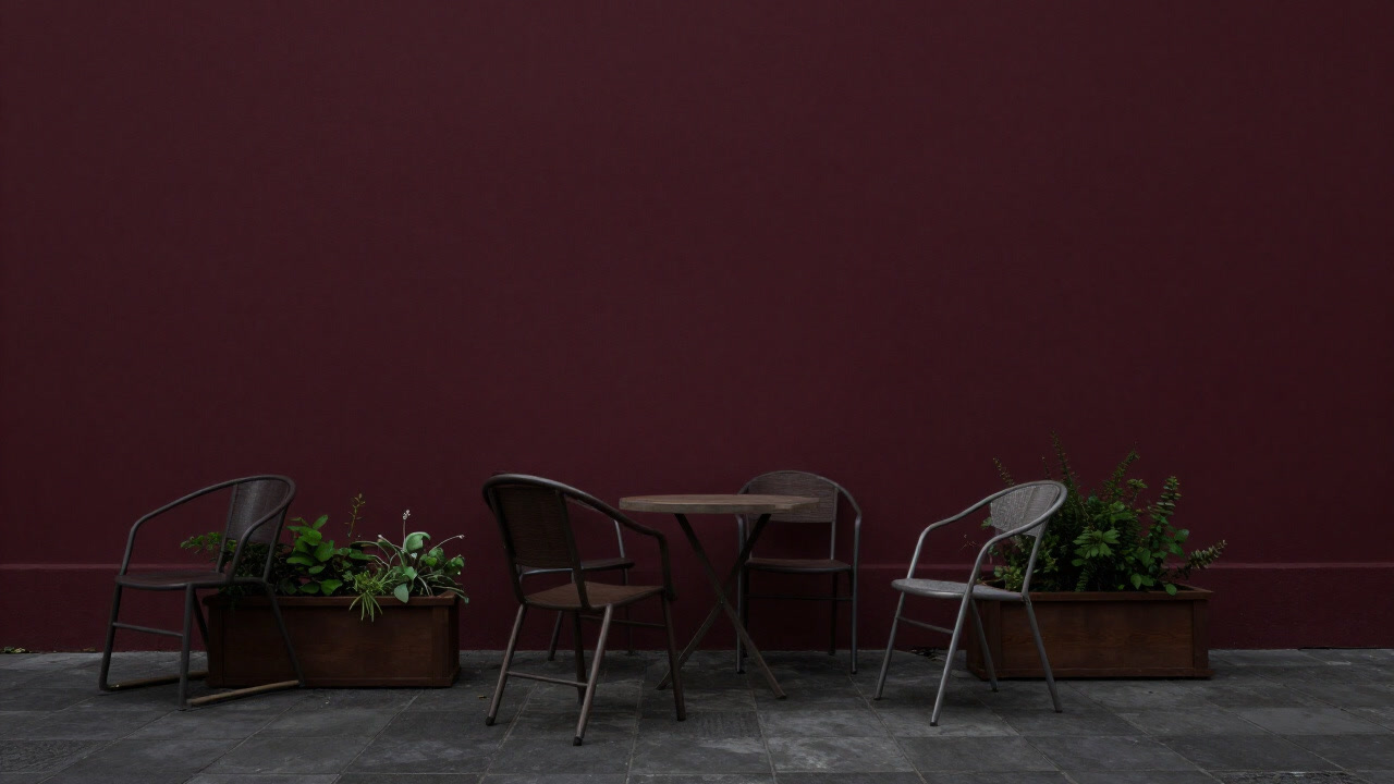 Photo of a terrace with planters and chairs casually placed, giving off more of a derelict vibe