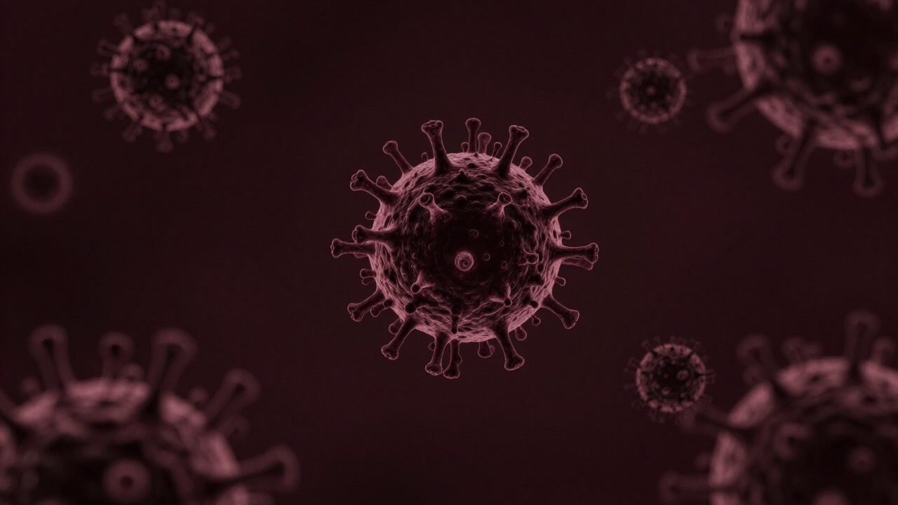 A CGI virus floating in darkness, its spiky surface glowing eerily as if glaring at surrounding cells.